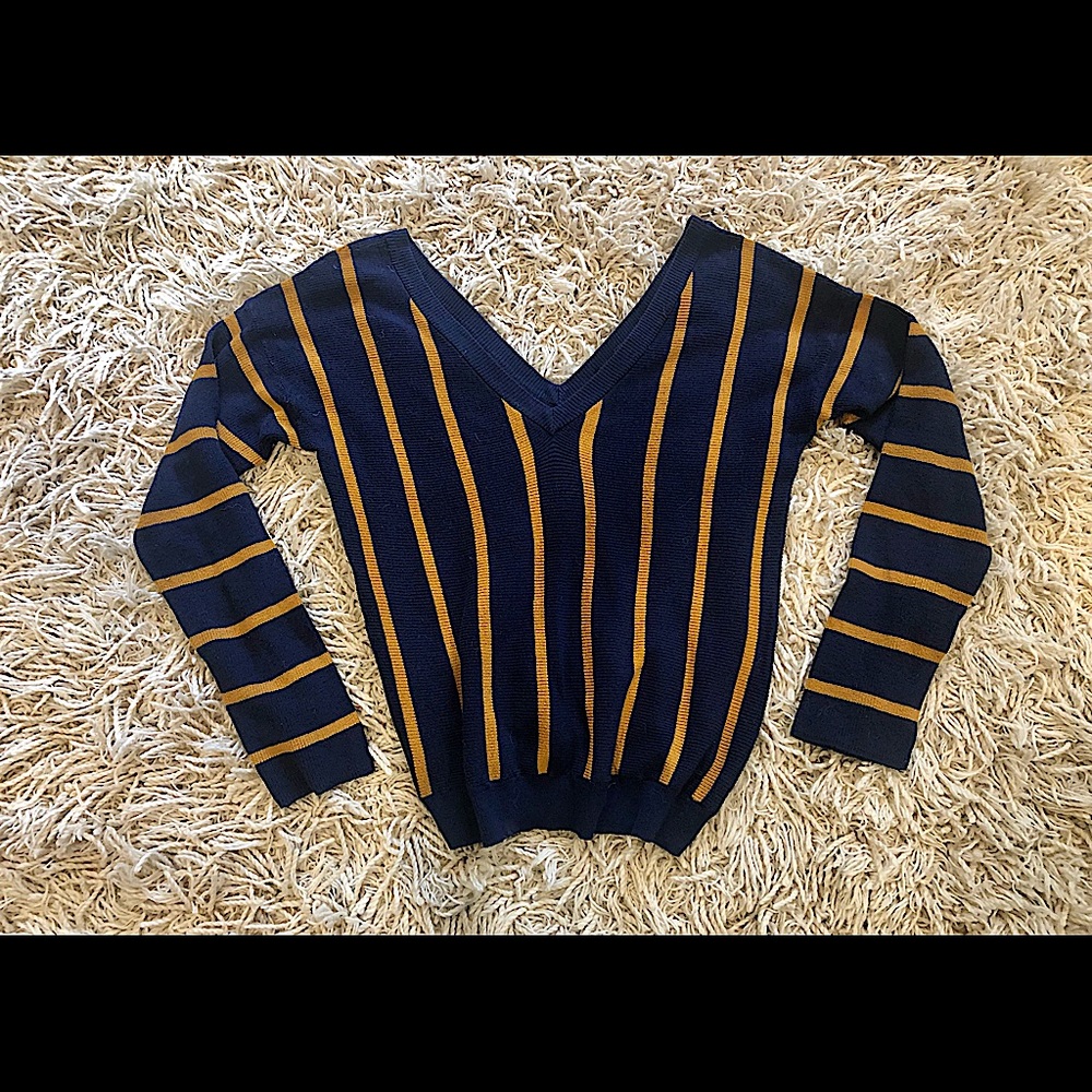 Long sleeve shirt with v-neck in back and front. Lays nice on the bod.
